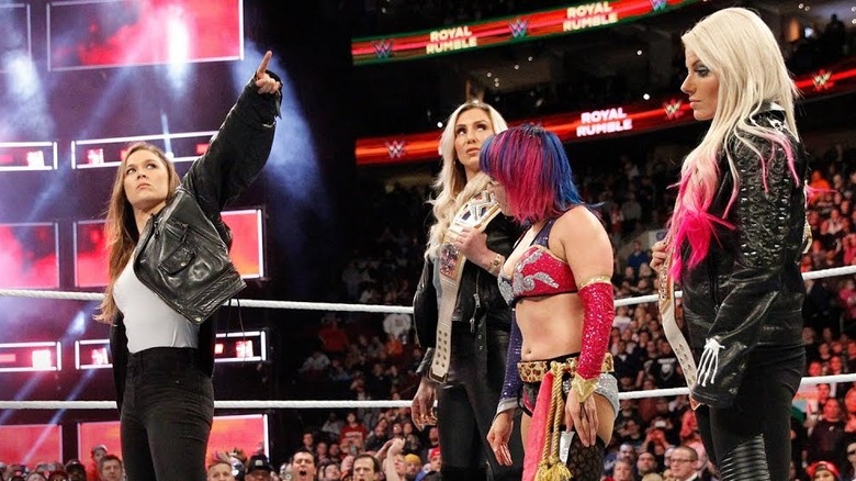 Ronda Rousey points at WrestleMania sign
