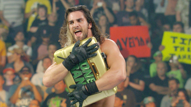 Rollins hugs MITB Briefcase 