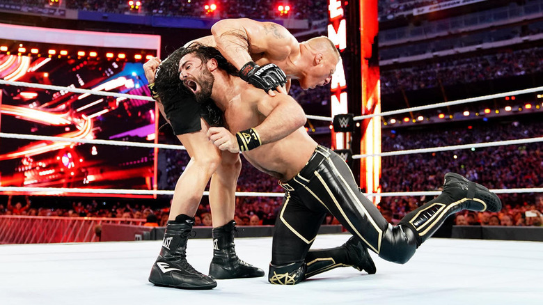 Rollins Low Blows Lesnar