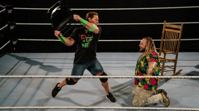 John Cena hitting Bray Wyatt with chair