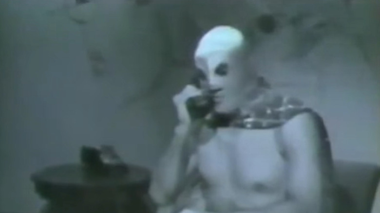 El Santo on phone