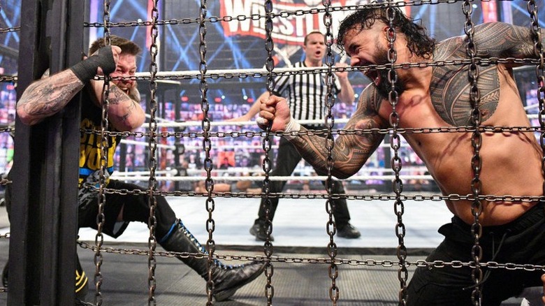 Jey Uso traps Kevin Owens' arm on the Elimination Chamber door