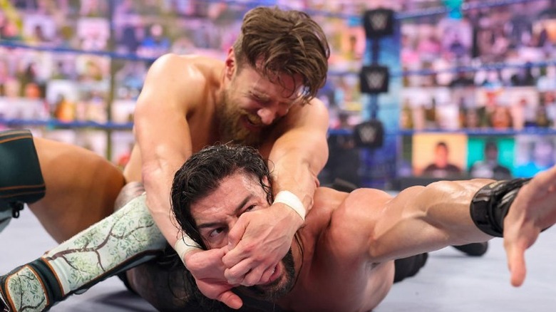 Daniel Bryan with the Yes Lock locked in Roman Reigns