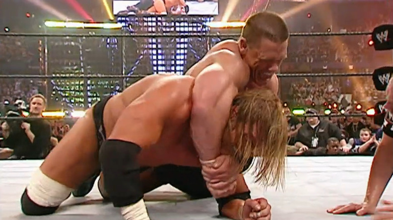 John Cena puts Triple H in hold