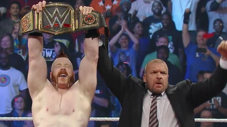 Sheamus and Triple H celebrating 