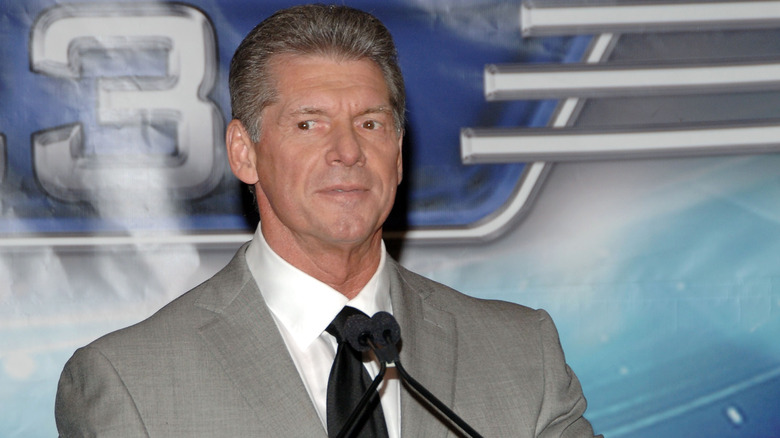Vince McMahon at a microphone