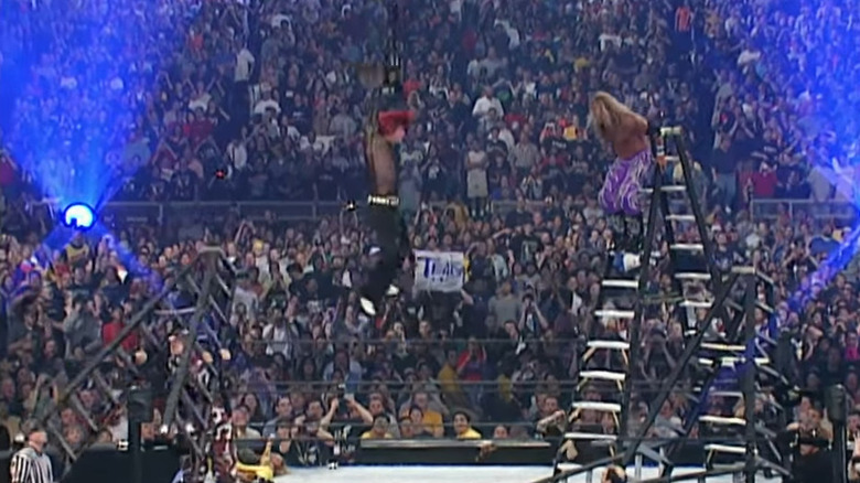 Edge about to spear Jeff Hardy from ladder 