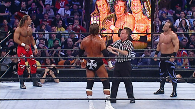 Shawn Michaels, Triple H and Chris Benoit pre-match
