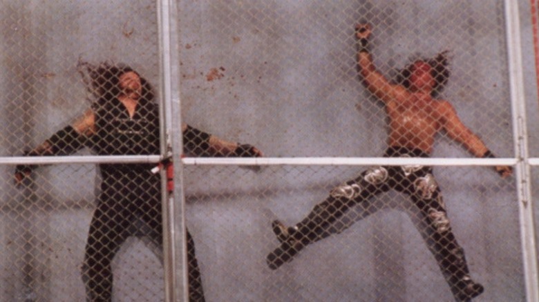 Undertaker and Shawn Michaels battered and beaten