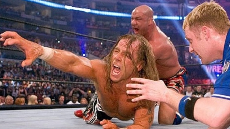Kurt Angle puts Shawn Michaels in the ankle lock
