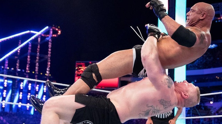 Brock Lesnar suplexing Goldberg