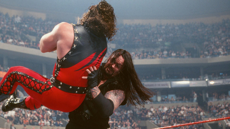 Undertaker chokeslamming Kane