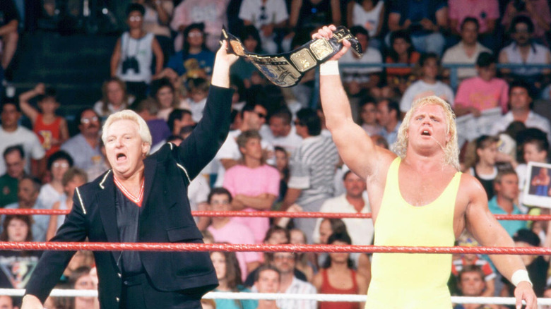 Bobby Heenan celebrates with Mr. Perfect