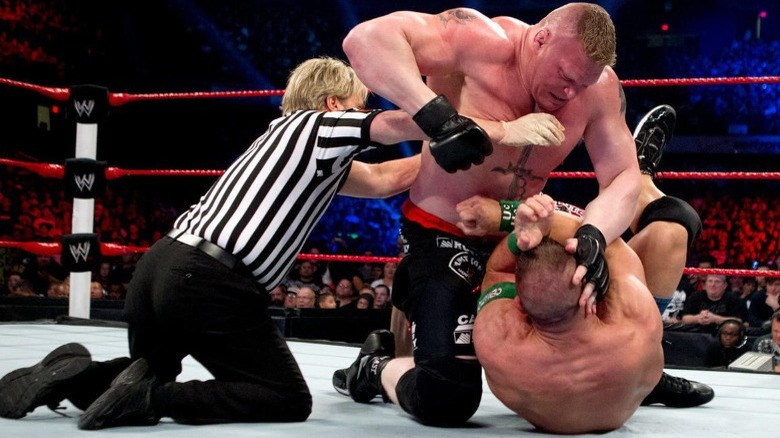 Brock Lesnar punching John Cena