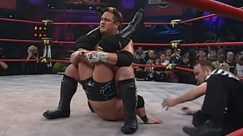 Joe putting Styles in a submission hold