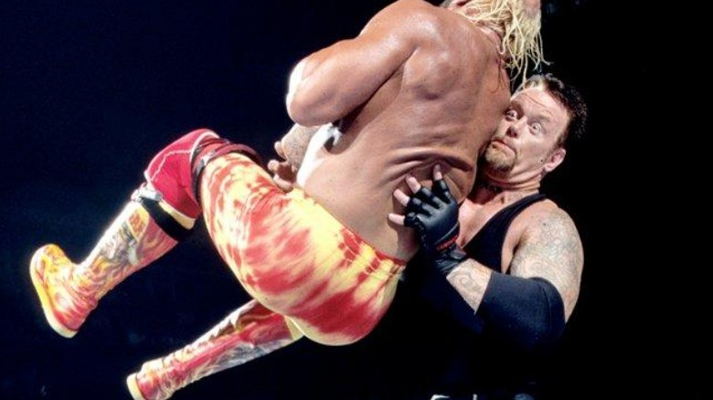 Undertaker chokeslamming Hulk Hogan