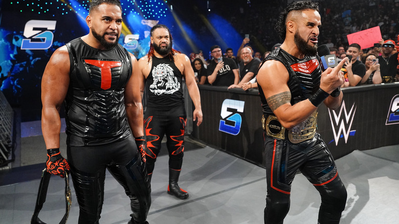 Tama Tonga and Tanga Loa with Jacob Fatu behind them