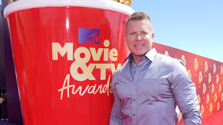 Mark Long next to a giant Golden Popcorn Award