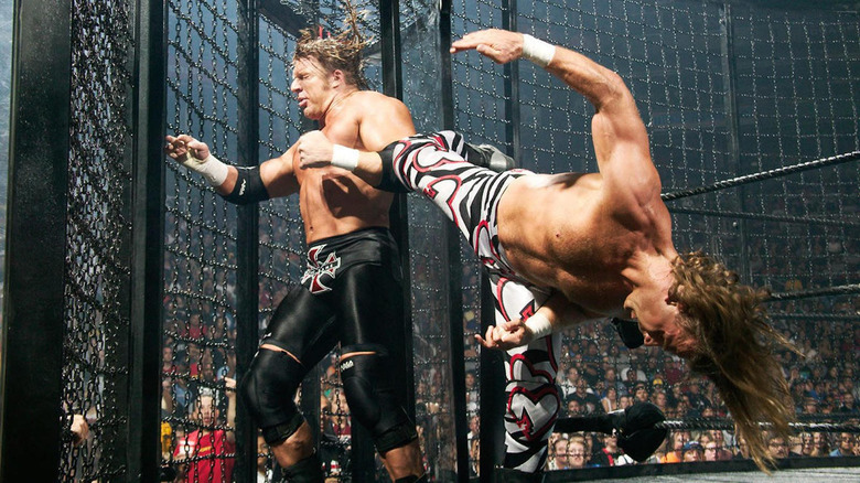 Shawn Michaels kicks Triple H in the head