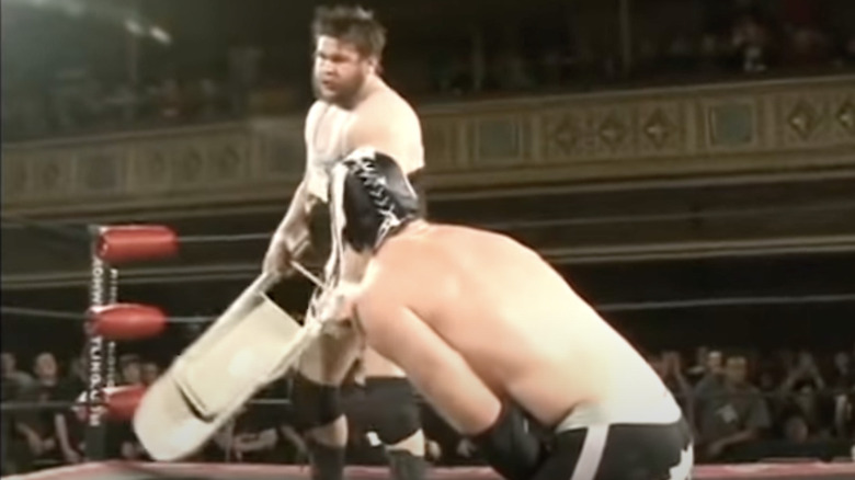 Kevin Steen about to hit Generico with a chair