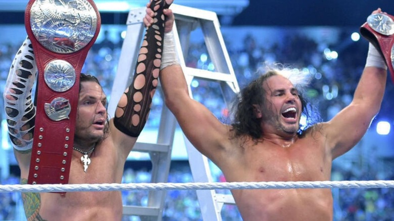 Matt and Jeff Hardy stand it the ring at WrestleMania 33, holding up their newly-won tag team championships.