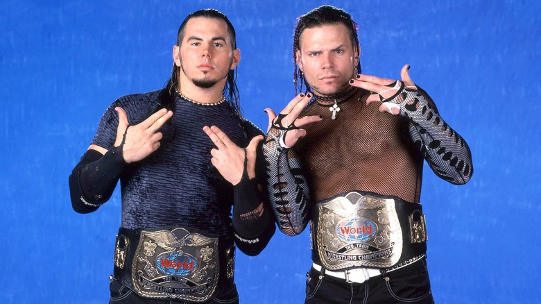 Matt Hardy and Jeff Hardy posing with the WWE World Tag Team Championships during a promo shoot, 1999