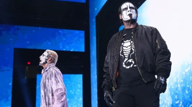 Darby Allin and Sting stand on the stage, staring down at the ring before a match on "AEW Dynamite."