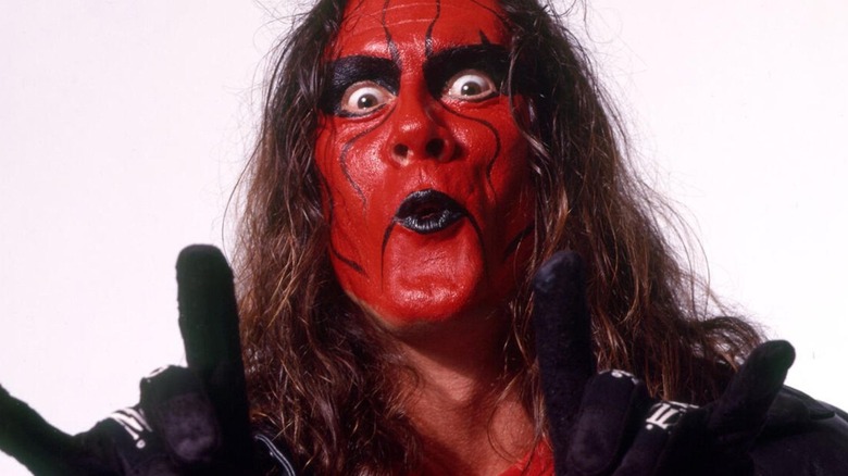 Sting poses for a backstage photo in WCW wearing red and black face paint, his look when he was a part of the nWo Wolfpac.
