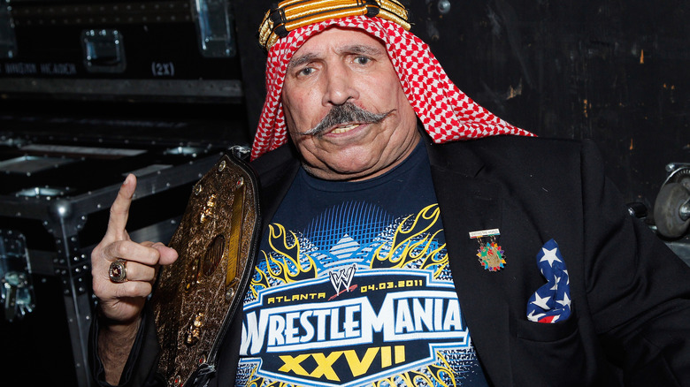 Iron Sheik posing backstage