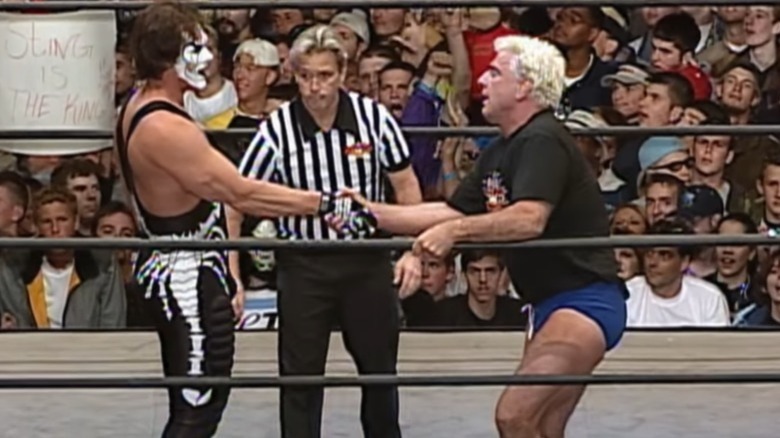 Sting and Ric Flair shake hands