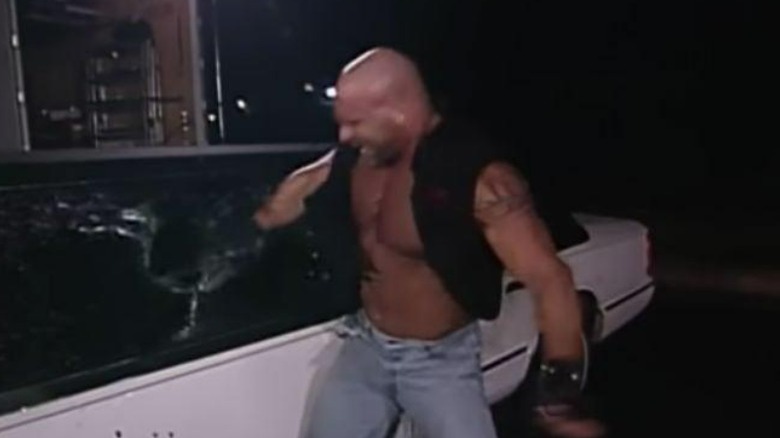 Goldberg smashing the limo's windows.