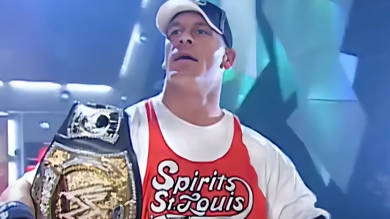 John Cena holding the WWE Championship.