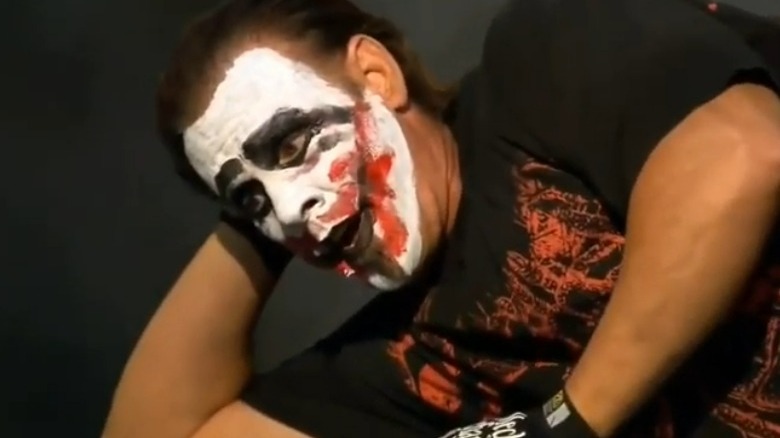 Sting leaning on elbow