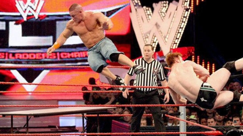 Sheamus sends John Cena flying through a table from the top turnbuckle during their tables match at TLC in 2009.