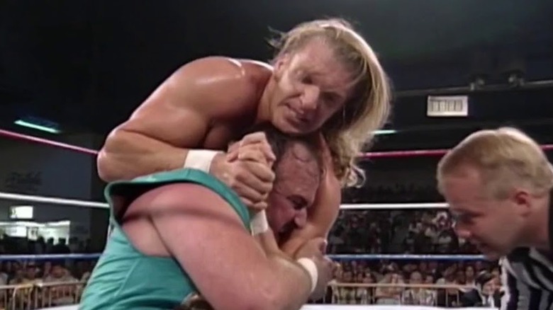 Triple H wrestles Jake Roberts
