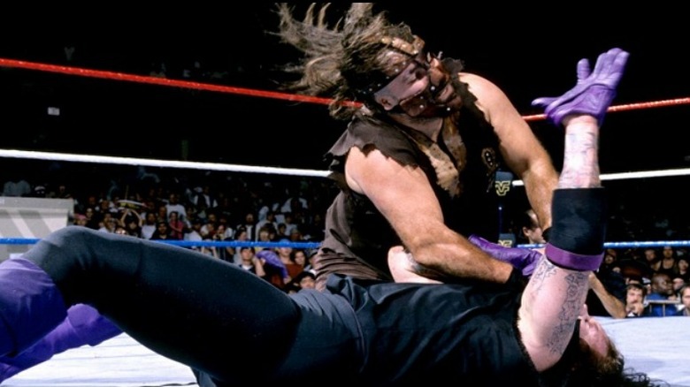 Mankind with the Mandible Claw on the Undertaker