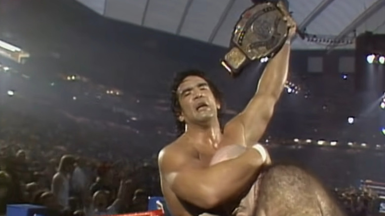 ricky steamboat holds title and hugs George Steele