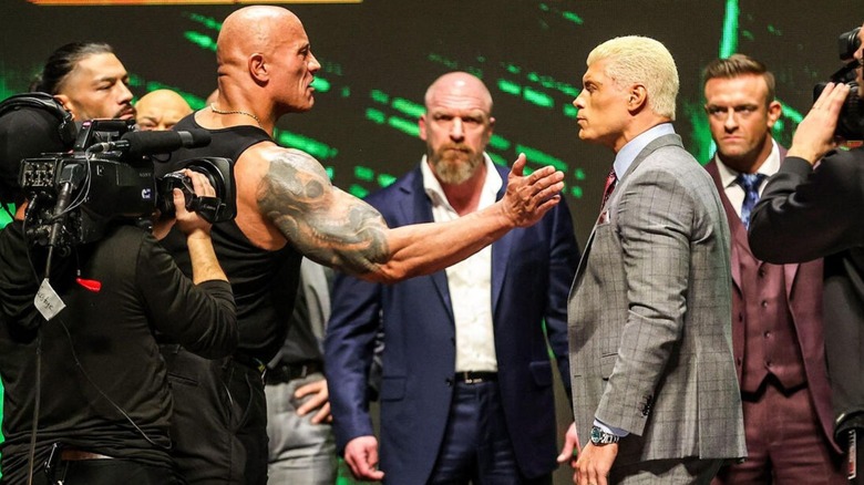 The Rock and Cody Rhodes face off on stage