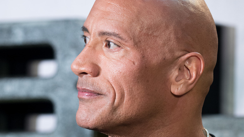 In Black Adam (2022), the Rock eyebrow raise is canonized to be