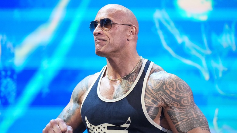Johnson rocks sunglasses and a tank top to open up "WWE Raw"'s first episode of 2024.