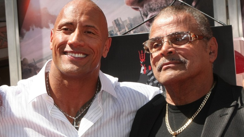 Dwayne and Rocky Johnson smiling