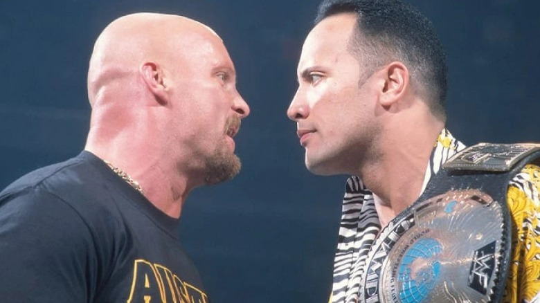 The Rock and Stone Cold staring each other down