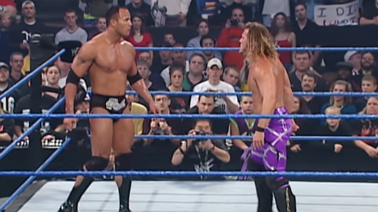 The Rock and Chris Jericho staring at each other