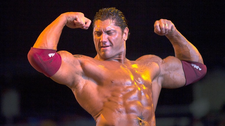 Batista flexing his muscles 