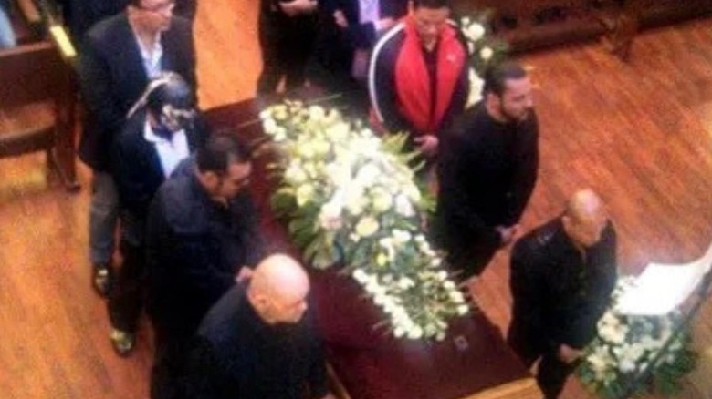 The casket of Perro Aguayo Jr. is seen being carried by pallbearers at his funeral.