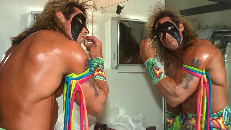 The Ultimate Warrior applying face paint