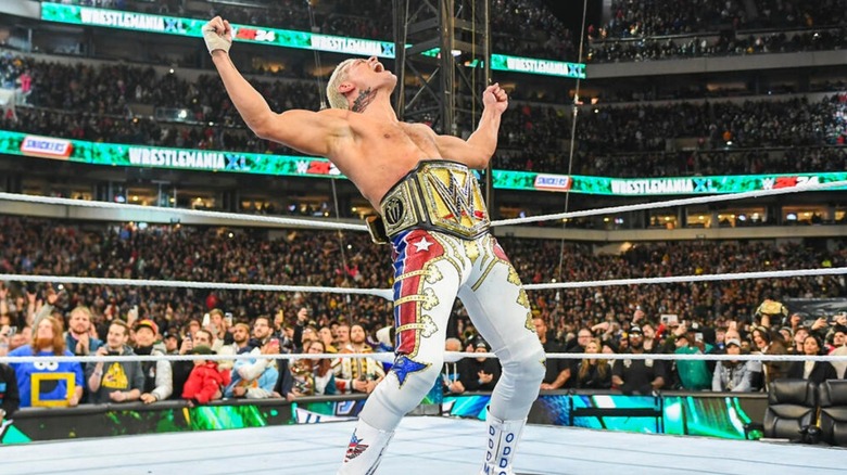 Cody Rhodes poses in the middle of the ring with the Undisputed WWE Championship around his waist after defeating Roman Reigns at WrestleMania 40.