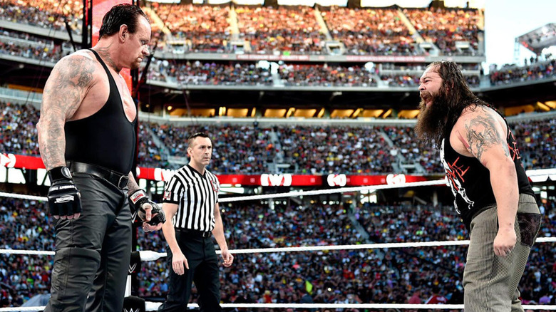 The Undertaker and Bray Wyatt in the ring