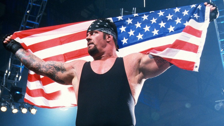 The Undertaker holding an American flag