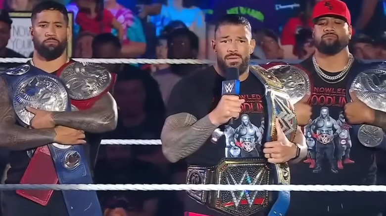 Roman Reigns and Usos hold titles